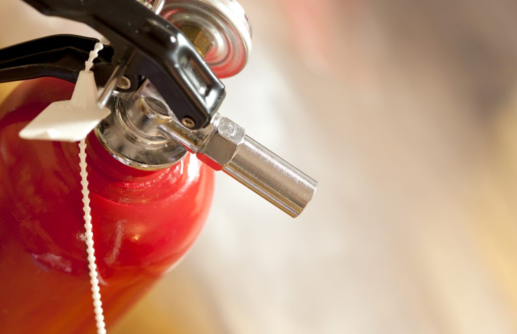 studio shot of fire extinguisher